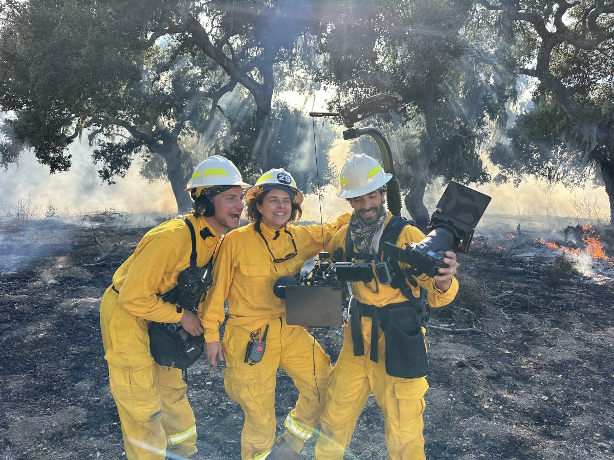 Film crew dressed in yellow with cameras